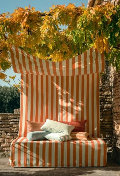 Orange and white striped cabana at the Bardo Beach Club